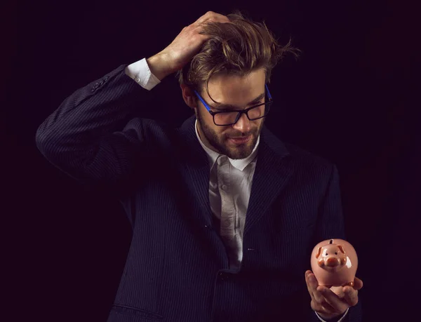 business man in black suit on black background, copy space