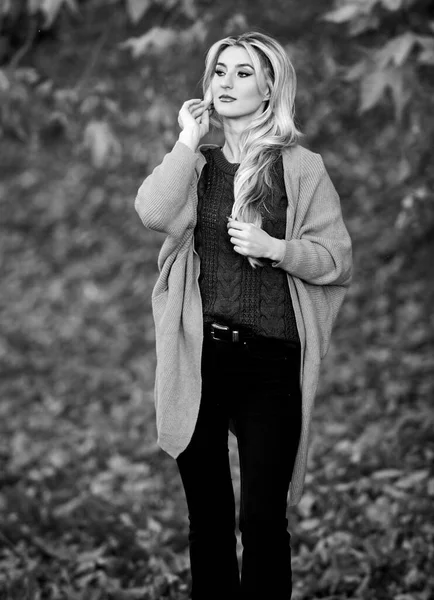 Girl adorable blonde posing in warm and cozy outfit autumn nature background defocused. Cozy outfit ideas for weekend. Woman walk sunset light. Clothing for every day. Cozy casual outfits for fall