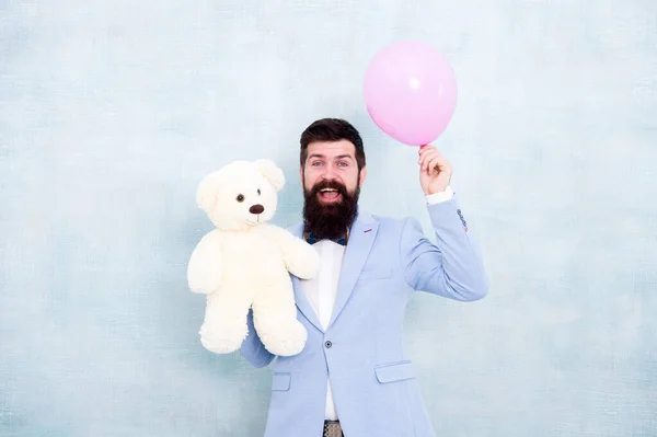 Valentines day gift. happy birthday. go for present shopping. brutal bearded hipster in formal wear. businessman hold bear toy and balloon. tuxedo man ready for romantic date. Love and romance — Stock Photo, Image