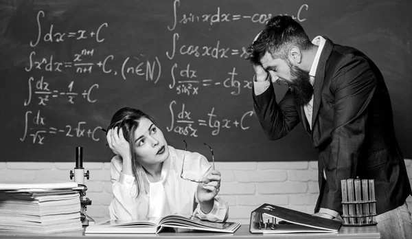 Shocked and tired. Shocked student covering face by hand. Sexy woman sit at teachers table. Bearded man with shocked face. Hipster having shocked expression. Problem and headache — Stock Photo, Image