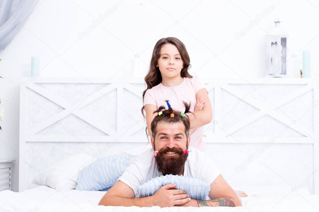Just smile. little girl love her daddy. happy fathers day. family. Fathers day with daughter at home. Daughter creating fathers hair. Handsome father with little girl. Happy father and daughter
