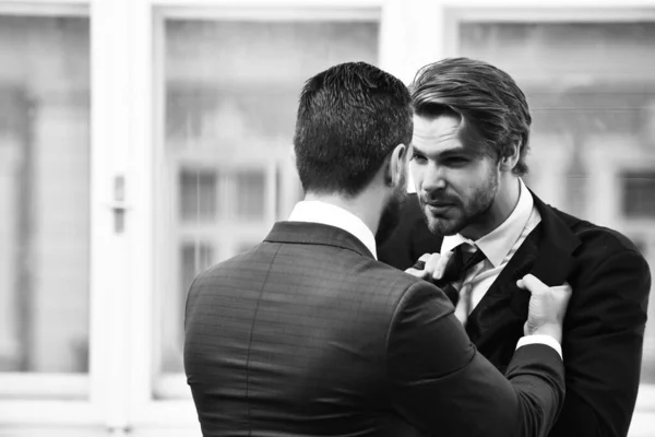 Conflict. Businessmens fight in elegant suits at office — Stock Photo, Image