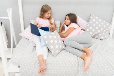 Read to me. Little girl read story to sister. Small kids read before bed. Literature and library. Children development. Developing imagination through reading. Just want nice bedtime read clipart