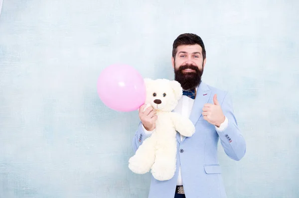Happy birthday. go for present shopping. brutal bearded hipster in formal wear. businessman hold bear toy and balloon. tuxedo man ready for romantic date. valentines day gift. Holiday celebration — Stock Photo, Image