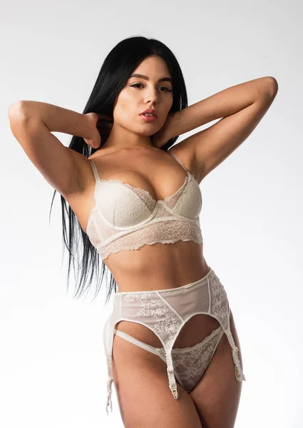 Clothes shop. Sexy female. Pretty girl with sexy look in lace underwear. Sexy model posing in erotic lingerie. Sexy woman. Girl wear bra and suspenders or garter belts. Sensual woman in lingerie — Stock Photo, Image