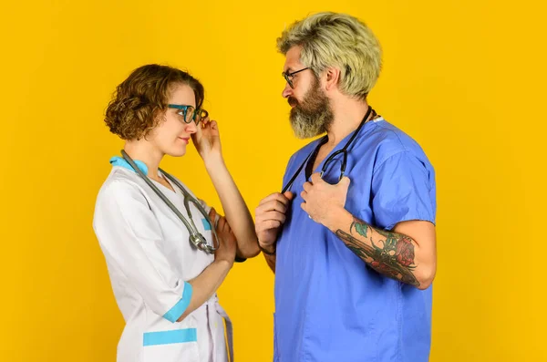 People in uniforms yellow background. Medical staff. trust our professionals. healthcare business. teamwork and people concept. doctor and nurse. Successful team of medical doctors. Be Safe — Stock Photo, Image