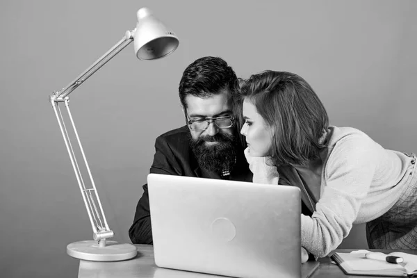 love affair at work. Seduction. secretary with boss at workplace. businessman and assistant solve problem. business couple at computer. woman and man work in office at laptop. Glad to see you in team