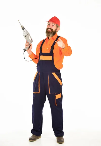 Safety measures. Drilling concept. Perforator and bit. Powerful drill. Buy drill. Toolbox tips drilling and fixing. Man in cap with drills white background. Professional builder repairman makes hole — Stock Photo, Image