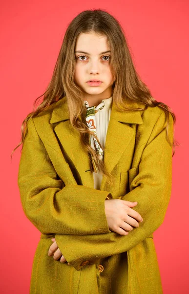 Girl fashion model wear coat for spring and autumn season. Oversize concept. Shopping. Trench coat fashion trend. Fashionable coat. Little girl posing jacket coat with collar. Clothes and accessory