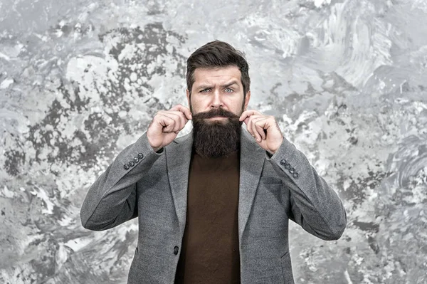 Mustache need proper styling. Grow facial hair. Hipster appearance. Stylish beard and mustache. Beard fashion and barber concept. Man bearded hipster fashionable coat. Barber tips maintain beard