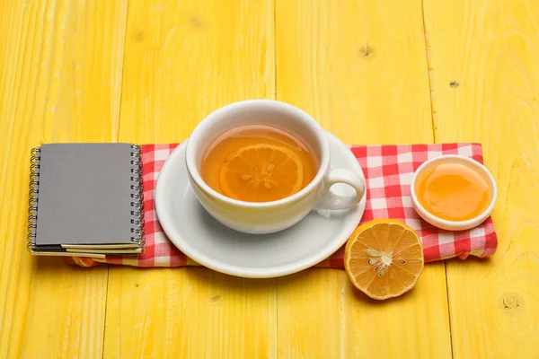 English tea time concept. Hot beverage with citrus slices