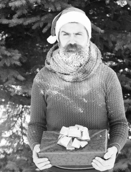 Handsome santa man with gift — Stock Photo, Image