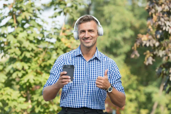 Reward yourself and encourage. Man drinking coffee listening favorite music artist. Lunch time. Coffee outdoors nature background. Eco friendly. Remote Productivity Tips to Better Work. Coffee break — Stock Photo, Image