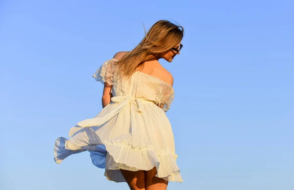 Mental health. Girl blue sky background. Emotional girl. Happy girl white dress feel free. Summer party. Sunny day. Carefree girl. Freedom. Impulsiveness and ease. Naturalness concept. Dancing woman — Stock Photo, Image