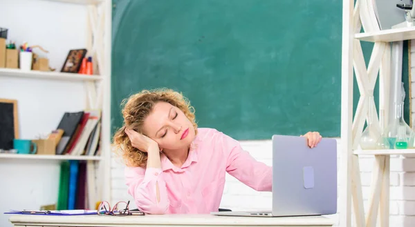 Exhausting lesson. Teacher exhausted after hard working day. School pedagogue stressful occupation. Tired student lean on desk. Tired tutor fall asleep at workplace. Woman tired in school classroom — Stock Photo, Image