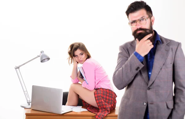 Sexy personal secretary. Full of desire. Having crush at work boost sexual desire. Bearded boss stand in front of sexy girl working laptop. Office manager or secretary. Sexy lady office worker