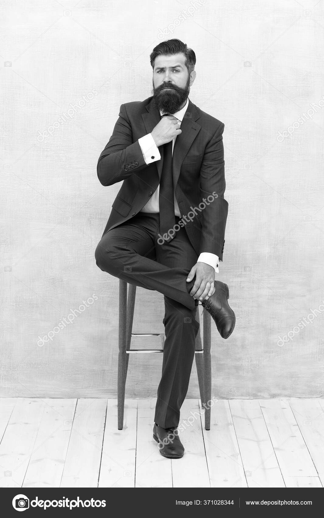 With lofty ambitions. Brutal man in elegant suit. Bearded man with formal look. Hipster sit on