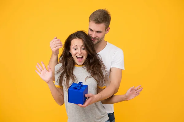 Make her wow. Surprised woman got present from man. Birthday surprise. Couple in love. Surprise box. Surprise gift. Present and souvenir. Gift shop. Gifting surprise. Happy Valentines day