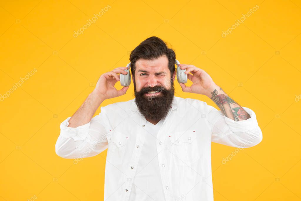 Ears health. Loud music. Hearing problem. Bearded man headphones. Active Noise Cancellation Technology. Hipster listen music stereo headphones. Modern wireless headphones. Dance music tracks