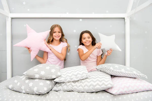 Happy morning. Cute cozy bedroom for small girls. Sisters having fun bedroom interior. Childhood concept. Bedroom place relax and enjoy rest. Children in pajamas. Stay at home. Pajamas all day — Stock Photo, Image
