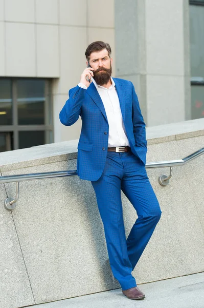 Talent to agree on everything. Remote business. Bearded man with smartphone. Businessman using smartphone. Audio message service. Mobile communication. Conversation concept. Informing partner