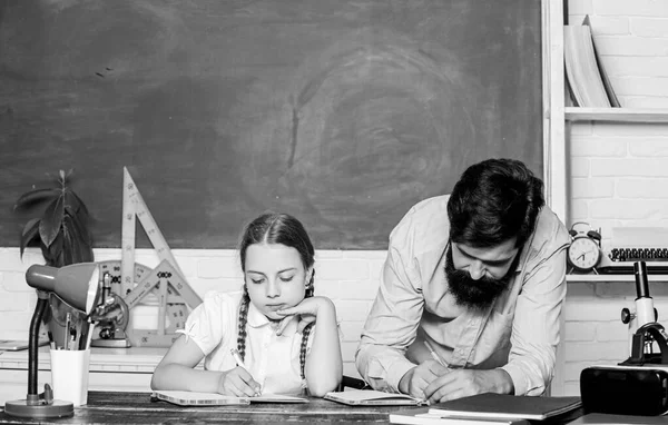 study together. bearded man teacher with small girl in classroom. back to school. education child development. knowledge day. Home schooling. daughter study with father. Teachers day