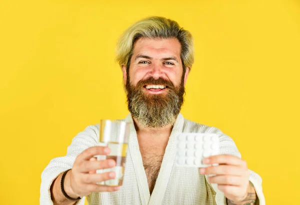 Try this. diseased man on quarantine. drink water glass. flu and cold. he has temperature. coronavirus prevention. stay home on lockdown. hipster man on self isolation. sick man on yellow background. — Stock Photo, Image