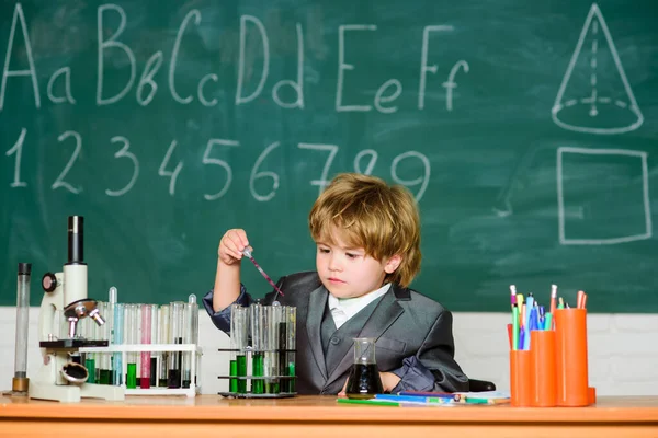 Biotechnology and pharmacy. Genius pupil. Education concept. Boy test tubes liquids chemistry. Chemical analysis. Knowledge day. Kid study chemistry. Experimenting with chemistry. Talented scientist — Stock Photo, Image