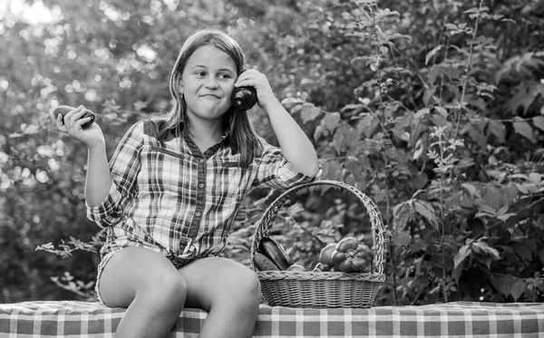 At work. kid on summer farm. Organic food. little girl vegetable in basket. Only natural. healthy food for children. harvest vitamin. spring market garden. happy little farmer. autumn harvest