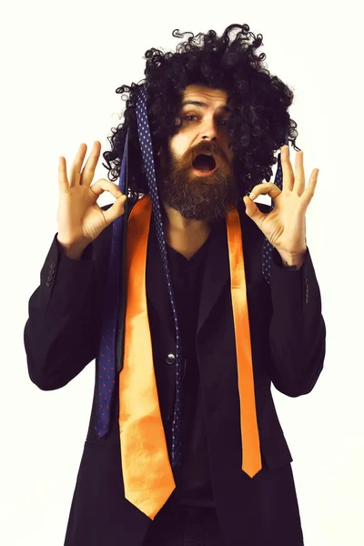 Caucasian hipster in suit and black curly wig — Stock Photo, Image