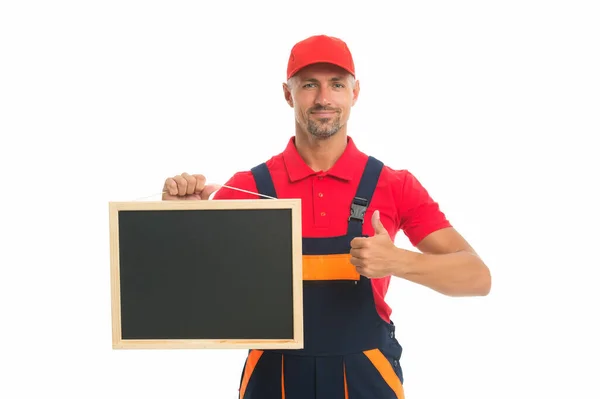 He loves his job. male worker in cap hold blackboard. board for copy space. builder service advertisement. best offer ever. move out or relocation loader. qualified repairman offers his services — Stock Photo, Image