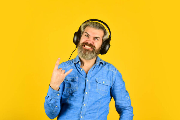 Hipster enjoy excellent sound song in earphones. Music beat. Noise cancelling function. Dj hipster. Excellent music playlist. Man bearded hipster headphones listening music. Singer on rehearsal