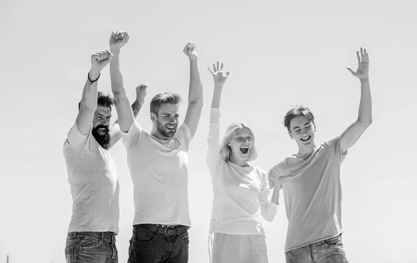 Group of four people. Freedom and success. young people bonding. Business team. youth psychology. men and woman sky backgroud. Spending great time with friends. move and the way will open — Stock Photo, Image