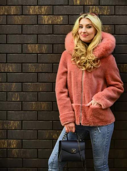 Natural wool sheepskin coat. Fur on hood. Stay warm and fashionable. Glamorous lady. Woman wear furry coat. Winter clothes. Fashion as unique as you are. Pink sheepskin coat. Fancy chic coat