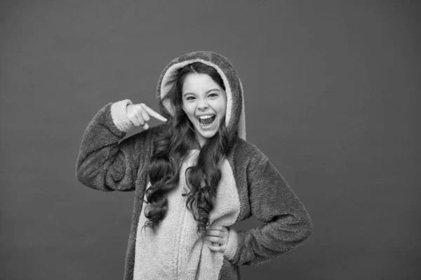 Beautiful me. Happy girl point finger red background. Small girl wear soft pajamas. Cute girl child feel comfy and relaxed. Cool girl never sleeps. Childhood and girlhood — Stock Photo, Image