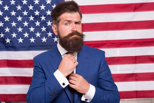 American politician in the election. his election campaign. Bearded businessman being patriotic for usa. American education reform at school in july 4. American citizen hipster at USA flag — Stock Photo, Image