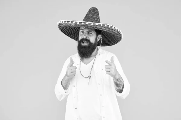 Mexican hat sombrero and mustache. guy happy festive outfit. his spanish costume. Cinco de Mayo Mexican celebration. travel to mexico. man in mexican sombrero hat. Man in festive mood at party