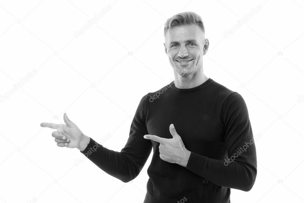 Your logo. Happy man pointing fingers isolated on white. Handsome guy pointing at something. Pointing and promoting. Pointing gesture. Marketing and advertising. Follow me, copy space