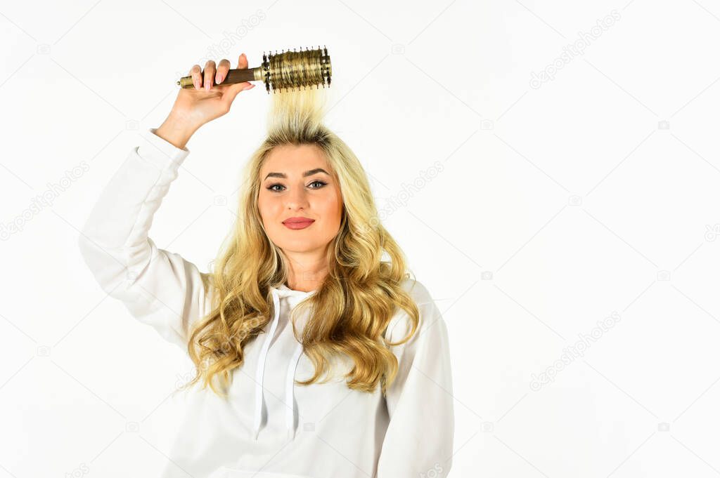 Hairdresser salon. Professional equipment. Beauty supplies shop. Curling Your Hair Much Easier. Hot curling brush. Pretty woman brushing hair isolated on white background. Long hair. Hair care