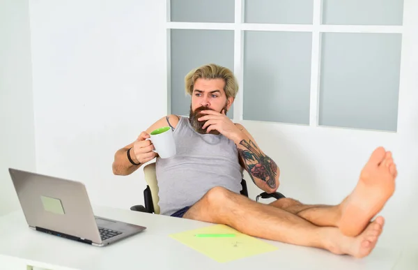 Barefoot guy working from home. Man working on laptop at home. Comfortable workplace. Developer work computer. Social networks communication. Social distancing. Relax yourself. Home is best office — Stock Photo, Image
