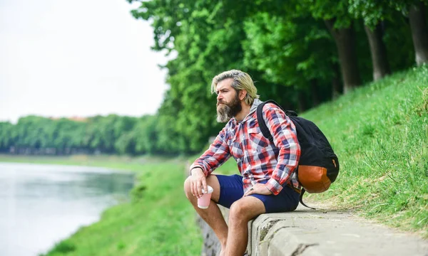 Time for thinking. Man drinking hot coffee. tourist relaxing in park drink tea or coffee. Coffee on the go. man with a cup of coffee outdoors. Handsome calm bearded man outdoors with a cup — Stock Photo, Image