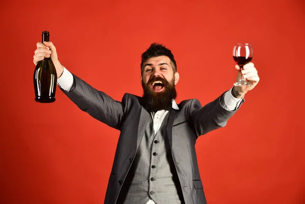 Winetasting and party concept. Degustator with beard and expensive wine