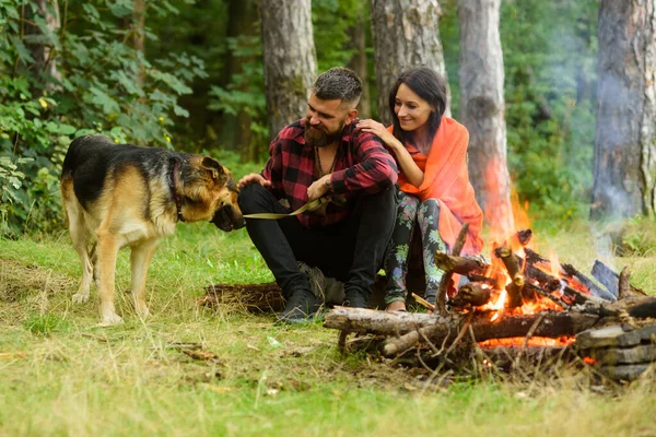 Family leisure concept. Couple play with german shepherd dog — Stock Photo, Image