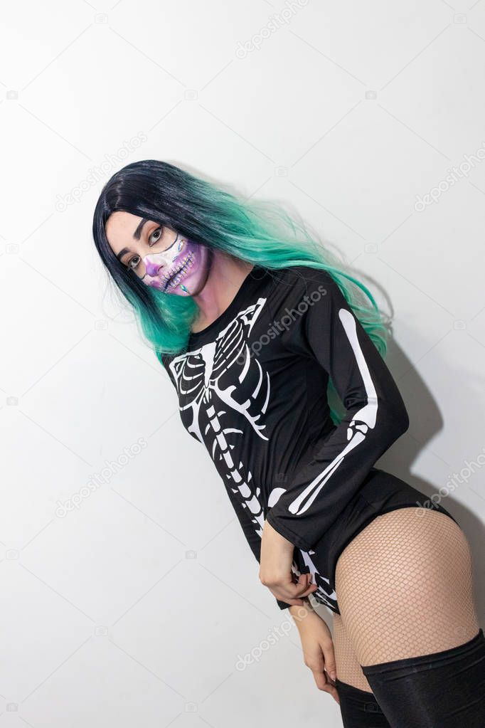 portrait of a girl with green hair and Halloween makeup
