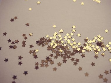 Altın yıldız lavanta kağıt arka plan üzerinde glitter