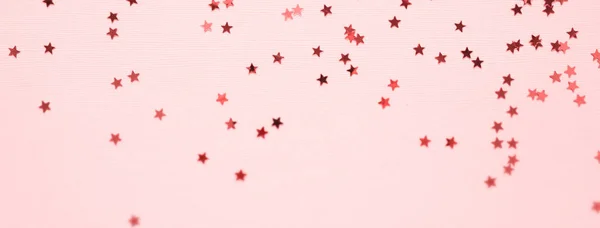 Gouden sterren glitter op roze achtergrond — Stockfoto