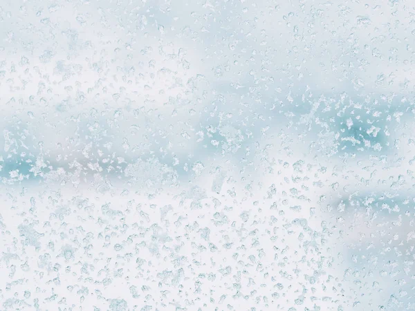 Patrón de escarcha en vidrio de invierno. Textura de hielo en la ventana —  Fotos de Stock