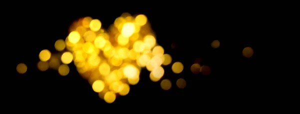 Vacaciones bokeh luces doradas Desenfocado brillante forma del corazón —  Fotos de Stock