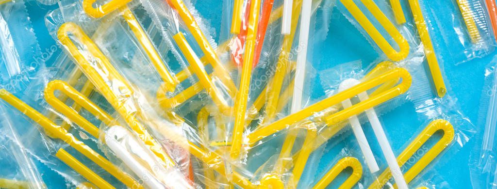 Pile of yellow drinking straws on a blue background Stock Image