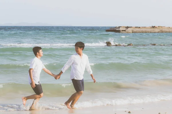 Homosexual portrait young asian couple running with cheerful tog — ストック写真